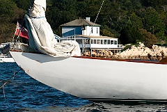 Ida Lewis Light in Background of Sailboat in Newport Harbor